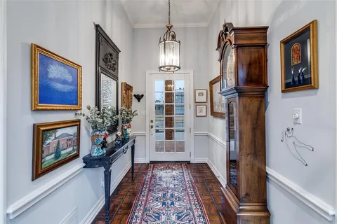 a hallway with fireplace and furniture