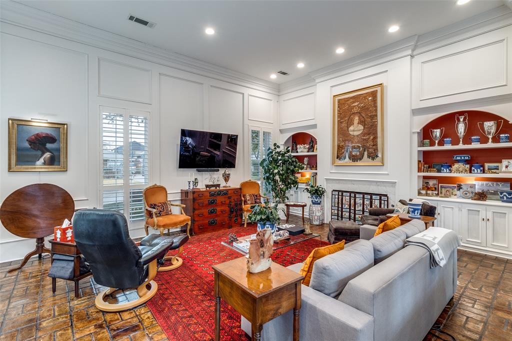 5723 Overdowns Drive Dallas, TX 75230 - Photo 8 of 36 a living room with fireplace furniture and a flat screen tv
