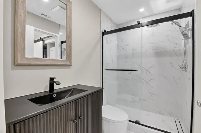 an aerial view of a house with outdoor space