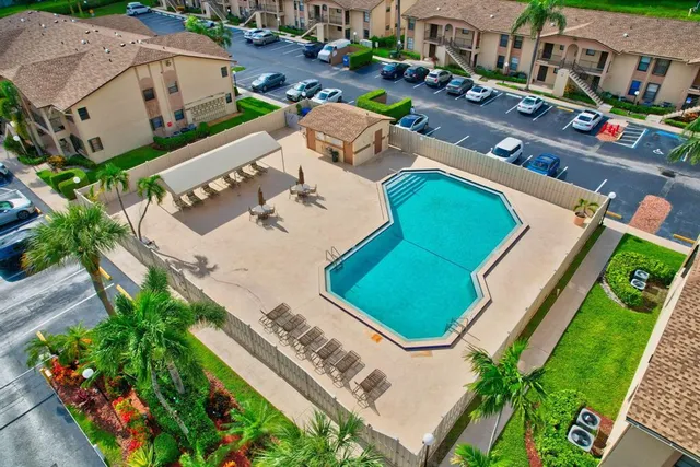 a view of a swimming pool with a yard