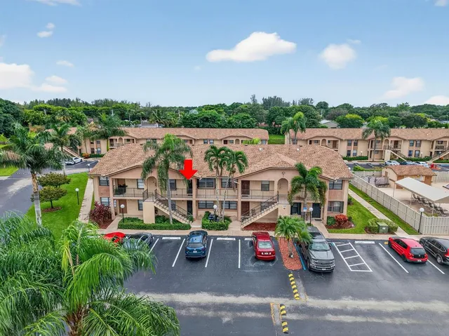 an aerial view of residential building and ocean