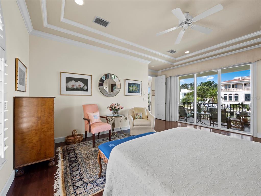 573 Spinnaker Lane Longboat Key, FL 34228 - Photo 12 of 43 a bed room with two bed and a large mirror