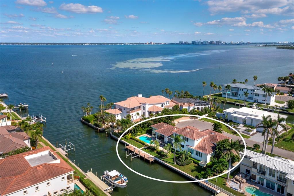 573 Spinnaker Lane Longboat Key, FL 34228 - Photo 2 of 43 an aerial view of a house with a lake view