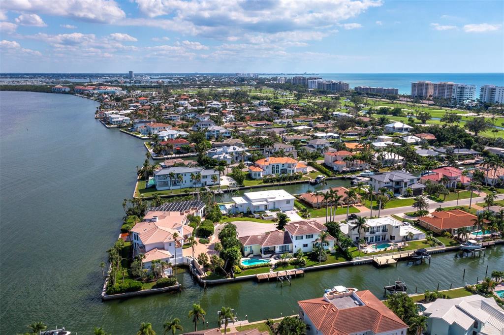 573 Spinnaker Lane Longboat Key, FL 34228 - Photo 40 of 43 an aerial view of residential houses with outdoor space and lake view