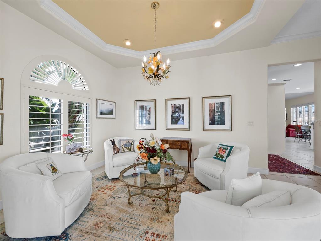 573 Spinnaker Lane Longboat Key, FL 34228 - Photo 4 of 43 a living room with furniture flowerpot and a window