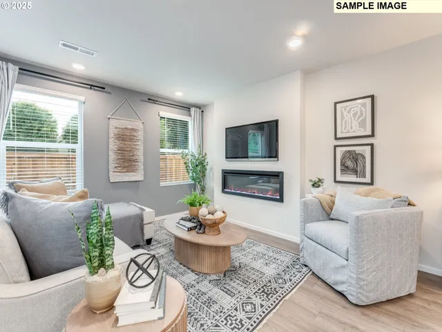 a living room with furniture a flat screen tv and a large window
