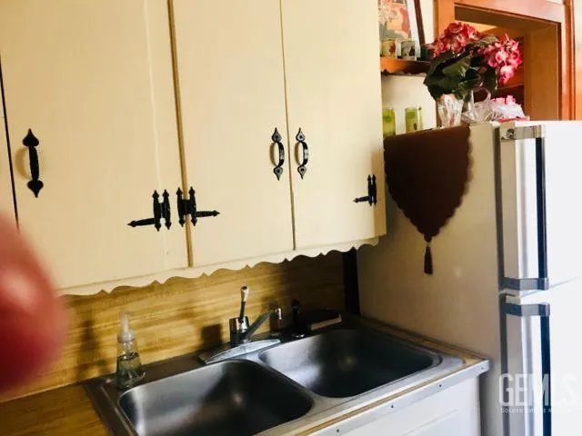 a kitchen with a sink and cabinets