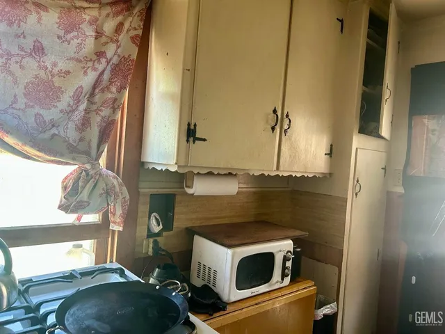 a bathroom with a sink and a washing machine