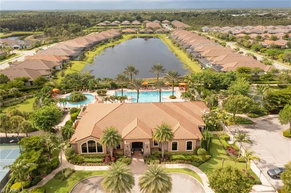 an aerial view of residential houses with outdoor space