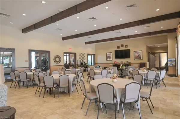 a living room with lots of furniture and a view of dining room