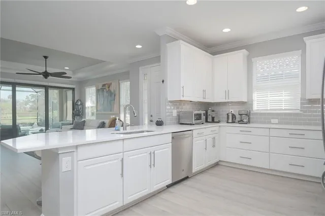 a kitchen with sink cabinets and window