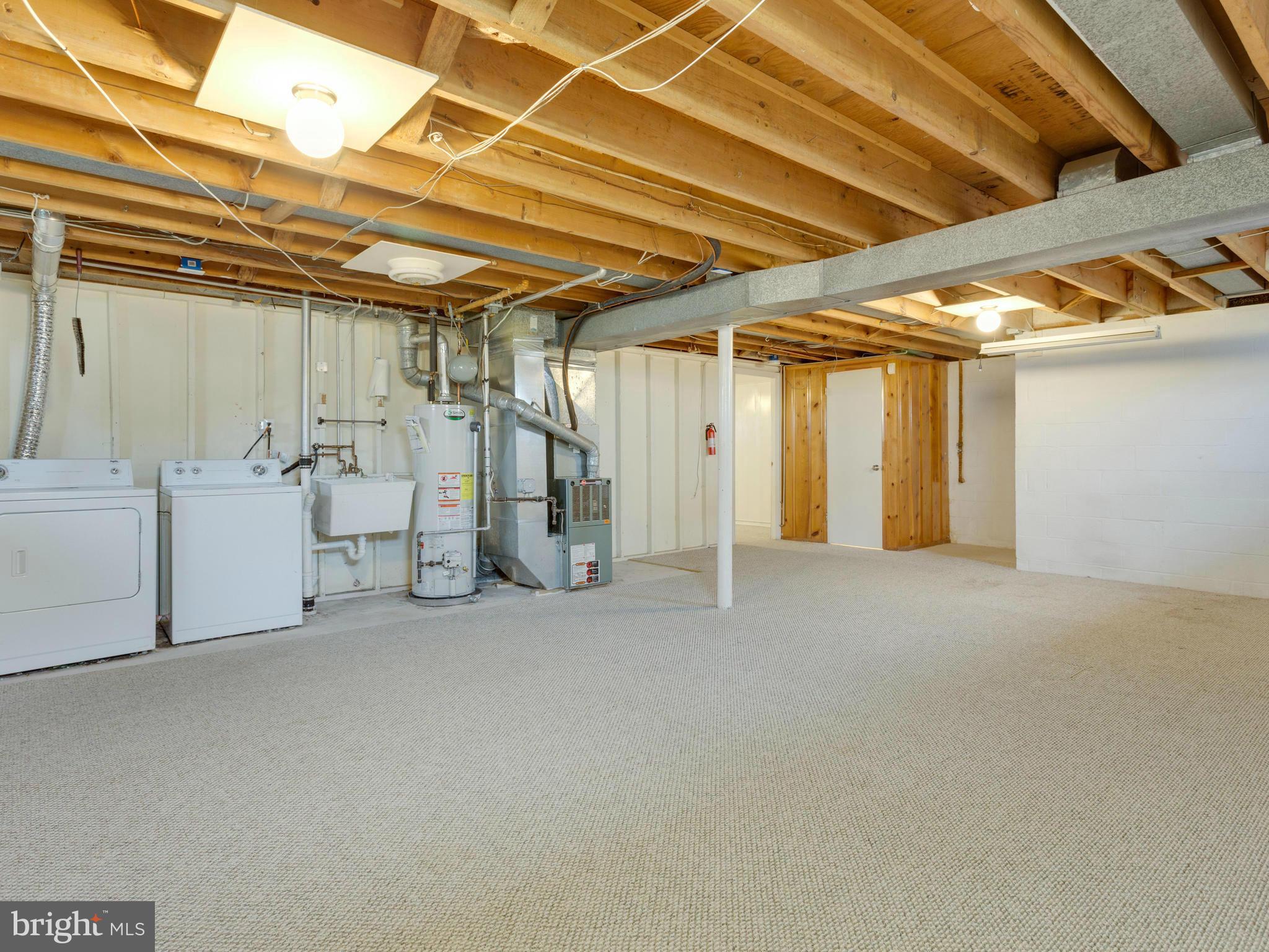 9007 Meadow Heights Road Randallstown, MD 21133 - Photo 19 of 28 Large Storage/Utility Room w/Washer & Dryer