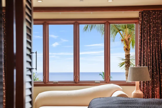 a view of swimming pool with outdoor seating and plants