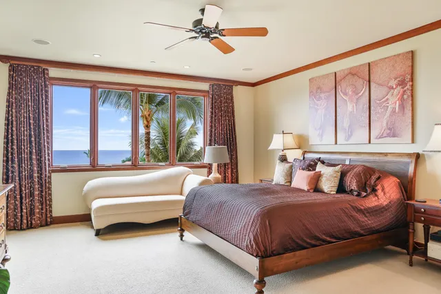 a spacious bedroom with a bed and window