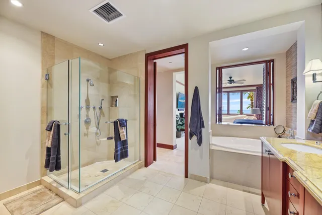 a spacious bathroom with a double vanity sink mirror and double