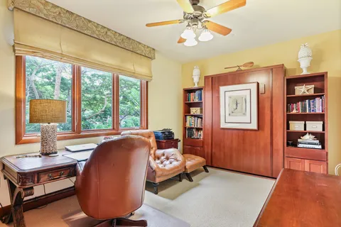 a bed room with a bed and a chair