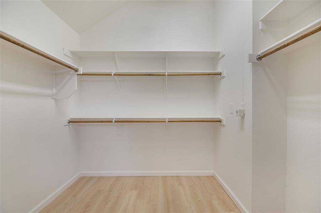 549 Hickory Lane Fate, TX 75087 - Photo 23 of 38 Walk in closet with light wood-style floors