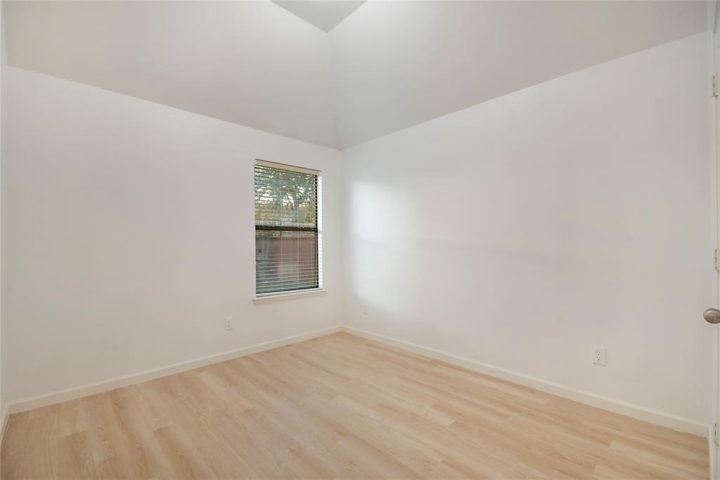 549 Hickory Lane Fate, TX 75087 - Photo 28 of 38 Spare room with light wood finished floors and a high ceiling