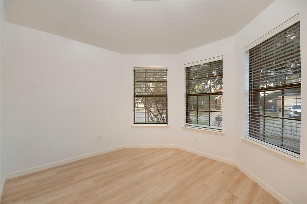 549 Hickory Lane Fate, TX 75087 - Photo 4 of 38 Spare room with light wood-type flooring and baseboards