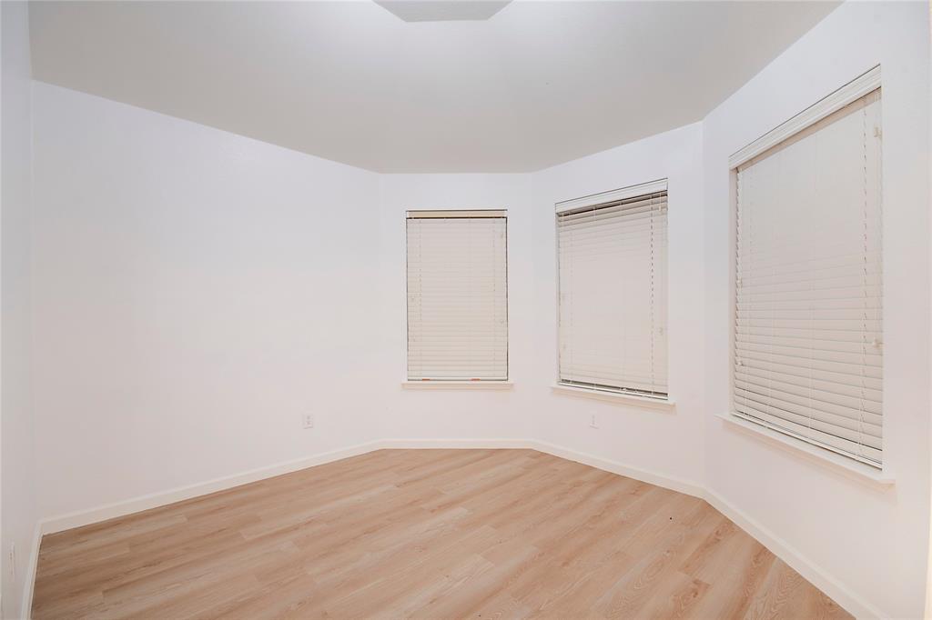 549 Hickory Lane Fate, TX 75087 - Photo 5 of 38 Empty room with light wood-style flooring and baseboards