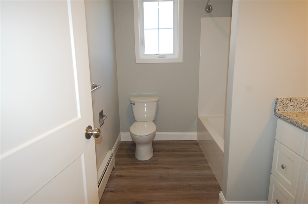 9 Bolton Road, Unit N Dartmouth, MA 02748 - Photo 17 of 19 a bathroom with a toilet and a window
