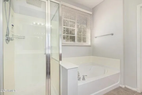a white bath tub sitting next to a window