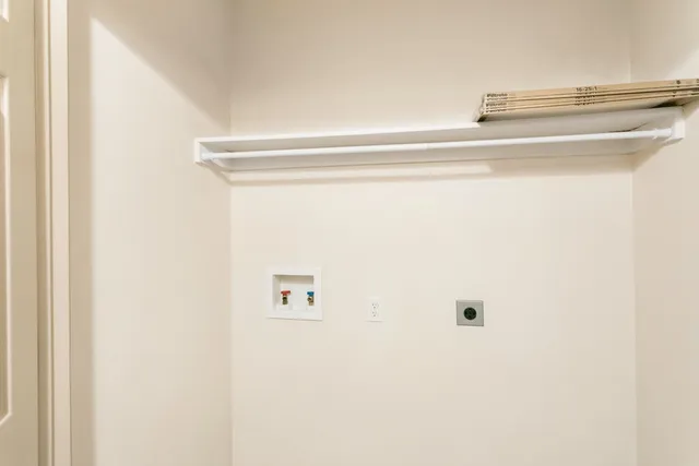 a sign that is on a white wall