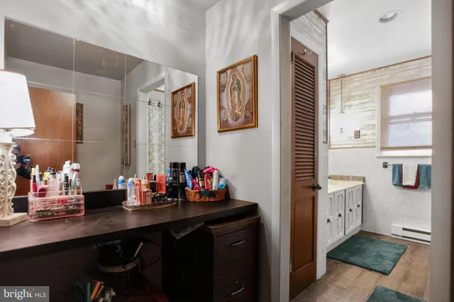 a bathroom with a sink and a window