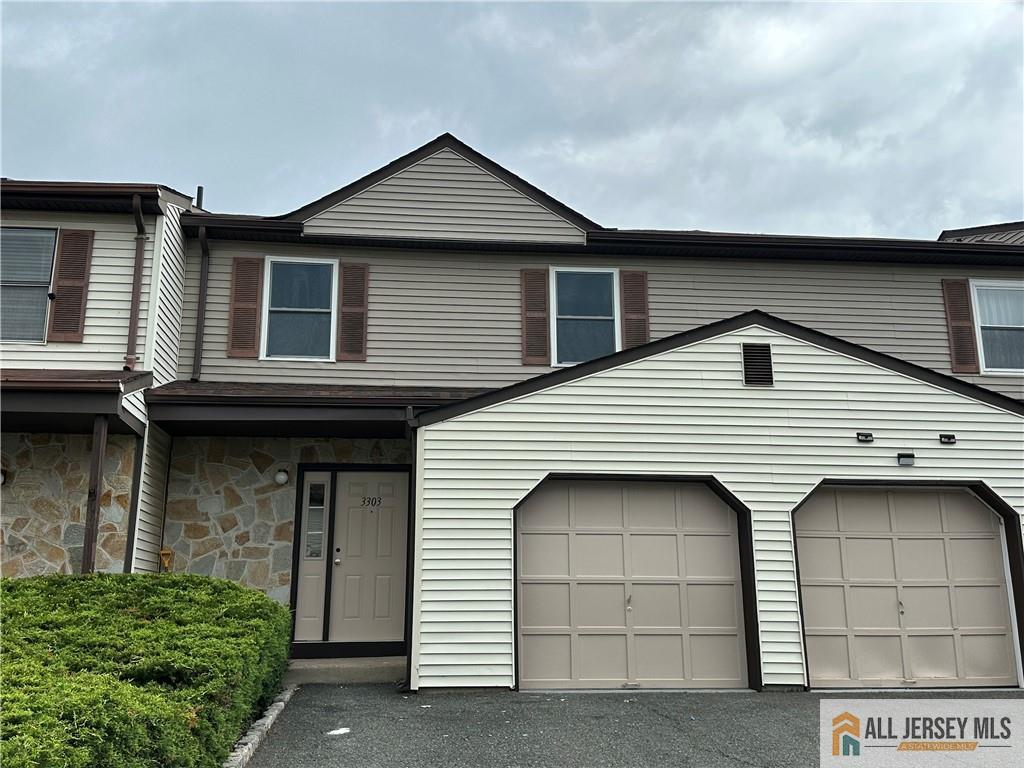 3303 Hana Road Edison, NJ 08817 - Photo 1 of 47 a front view of a house with a garage