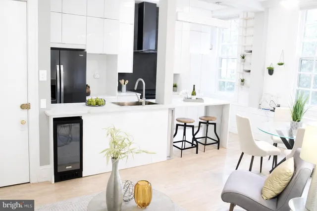 a kitchen with a sink and a stove top oven