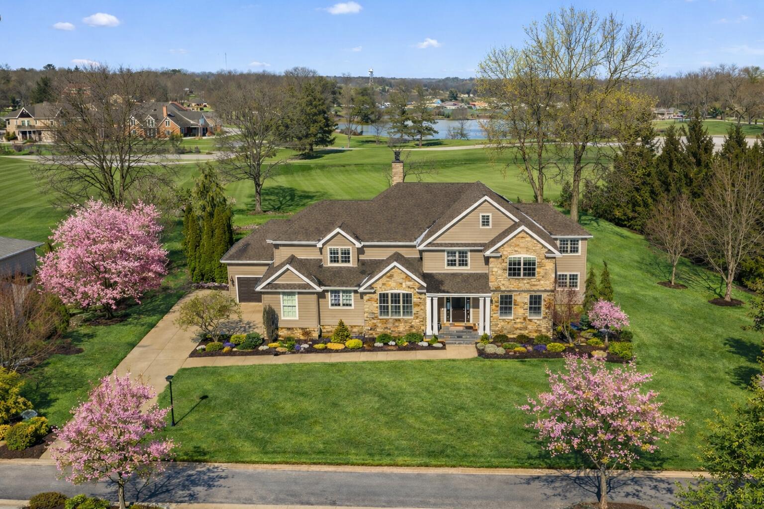 an aerial view of a house with garden space lake view and mountain view