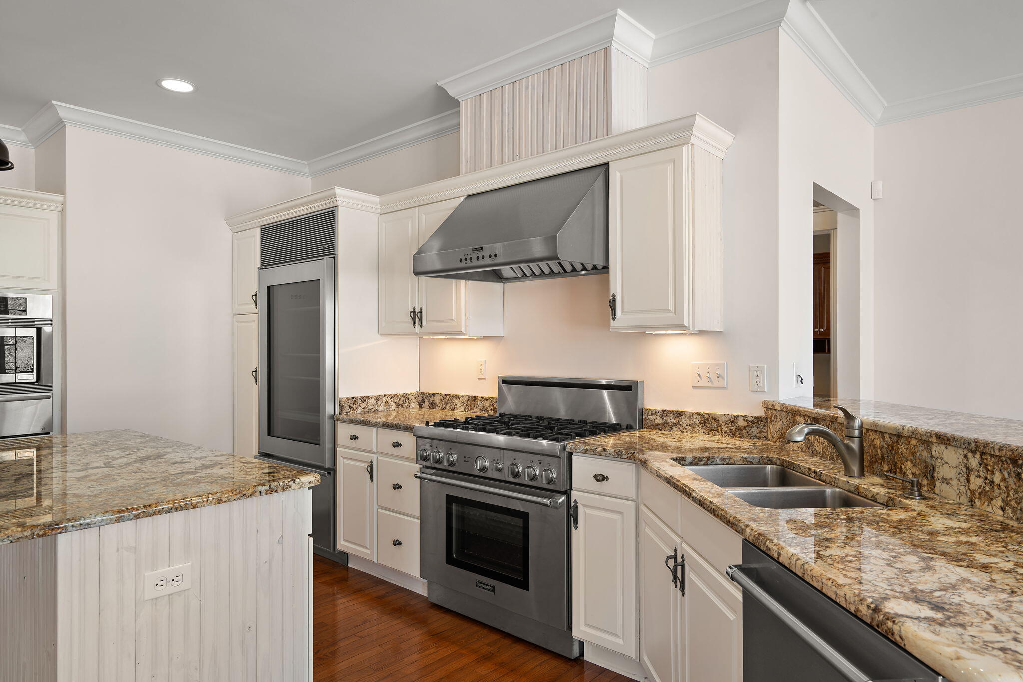 1240 Ryder Road Chesterton, IN 46304 - Photo 18 of 73 a kitchen with stainless steel appliances granite countertop a sink stove and cabinets