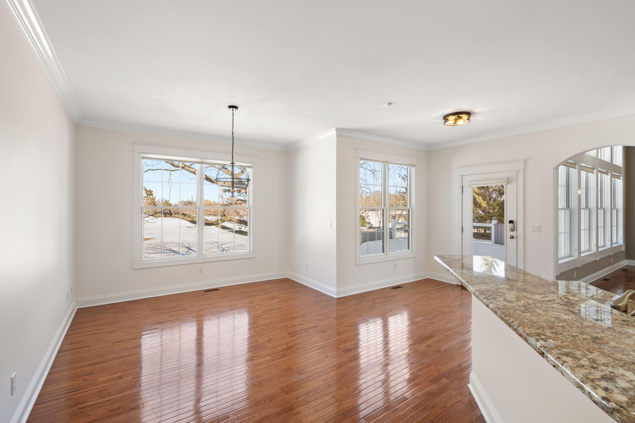 1240 Ryder Road Chesterton, IN 46304 - Photo 22 of 73 a view of an empty room with window and wooden floor