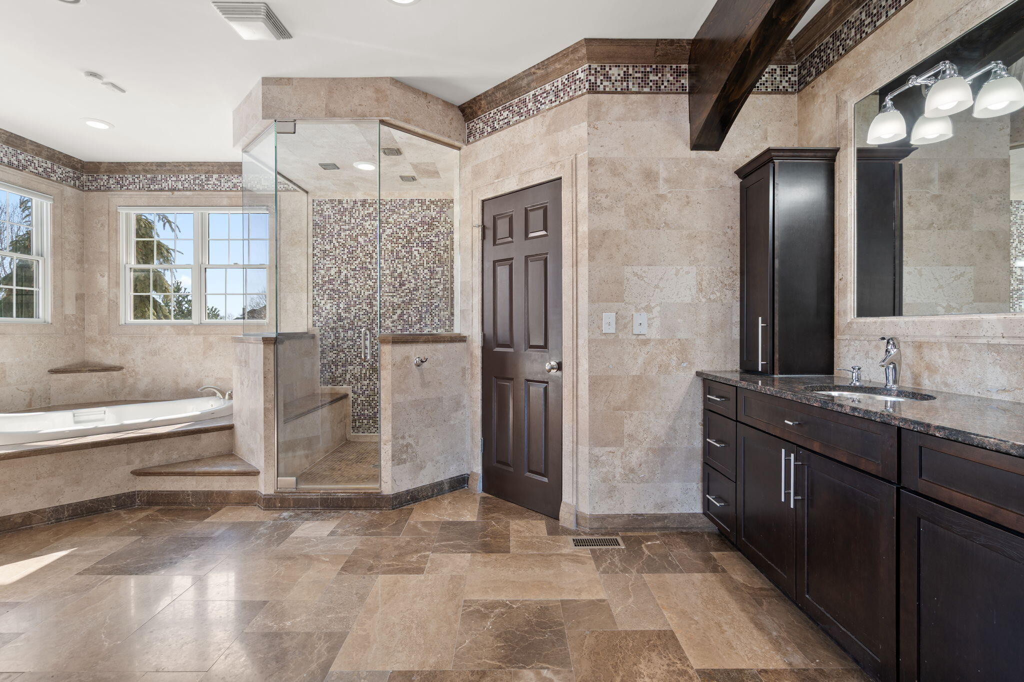 1240 Ryder Road Chesterton, IN 46304 - Photo 28 of 65 a bathroom with a bathtub and a double vanity sink mirror
