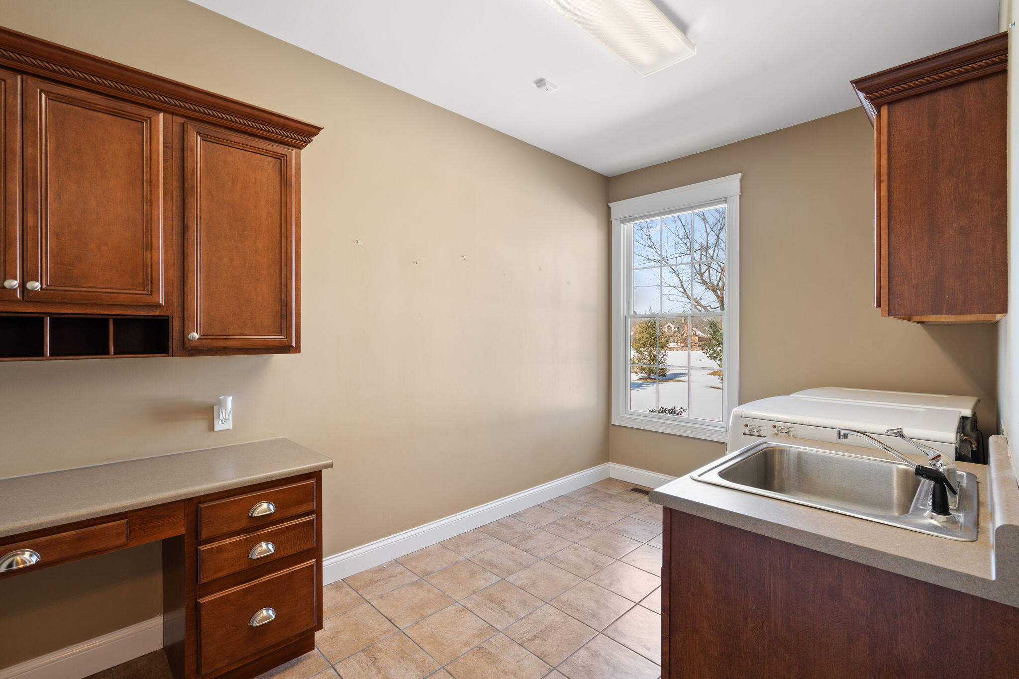 1240 Ryder Road Chesterton, IN 46304 - Photo 37 of 73 a view of a kitchen with a sink cabinets and a window