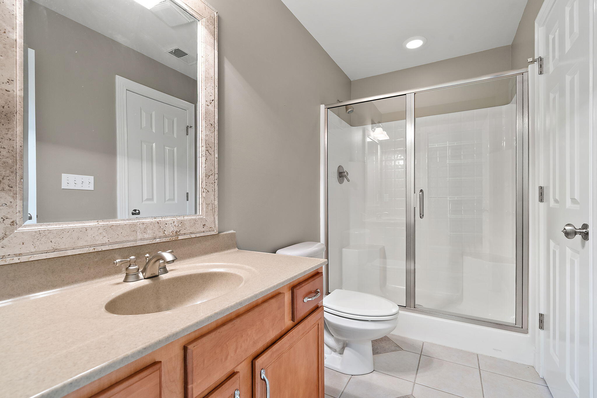 1240 Ryder Road Chesterton, IN 46304 - Photo 48 of 73 a bathroom with a sink toilet a mirror and shower