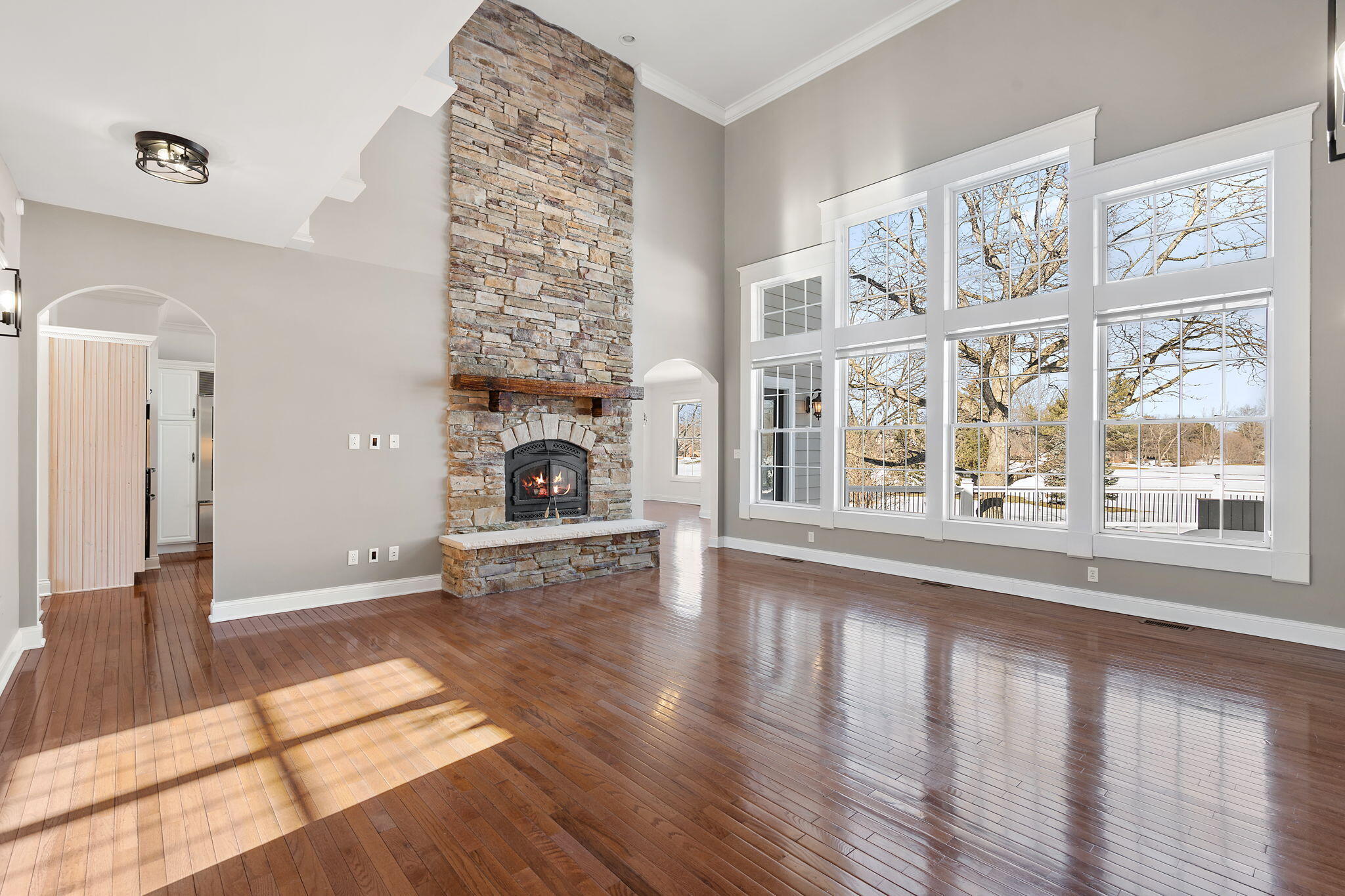 1240 Ryder Road Chesterton, IN 46304 - Photo 10 of 73 a view of an empty room with wooden floor and a fireplace
