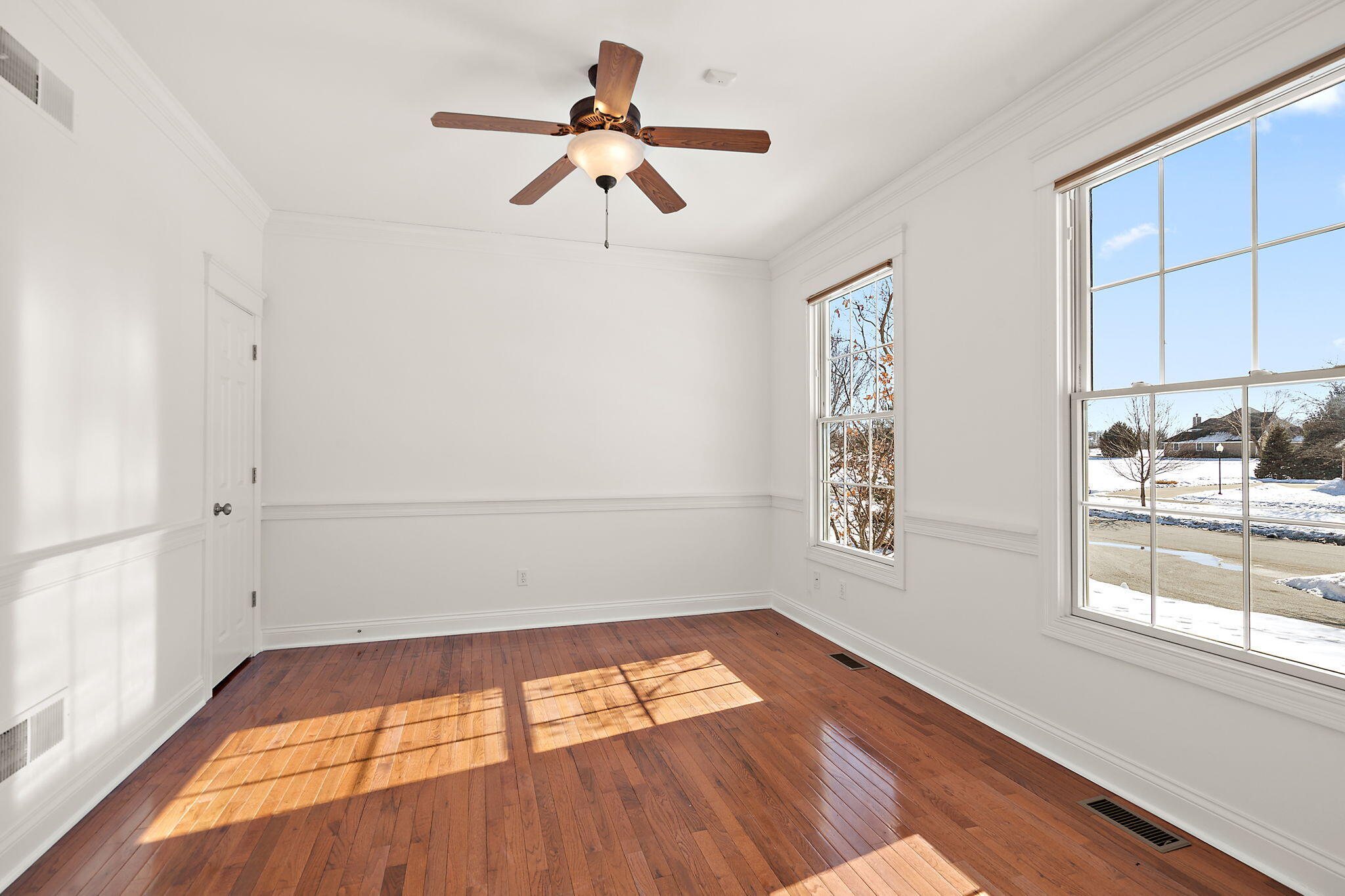 1240 Ryder Road Chesterton, IN 46304 - Photo 10 of 65 a view of empty room with wooden floor and fan