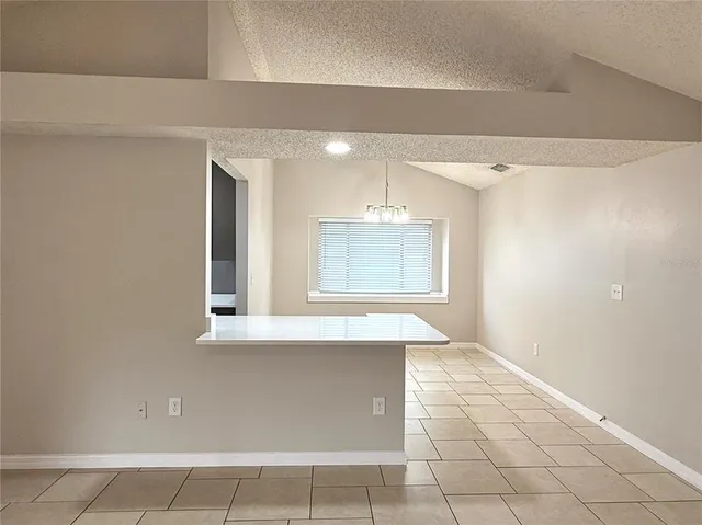 a view of a room that has a window in it