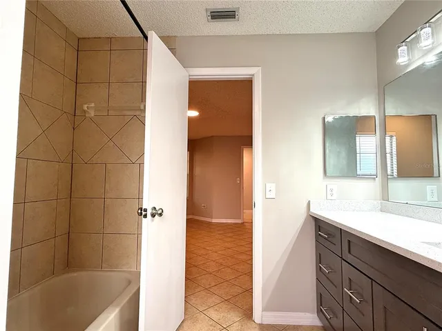 a bathroom with a sink and a bathtub