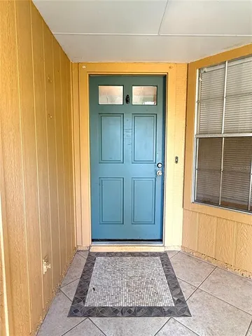 an entryway view with wooden floor