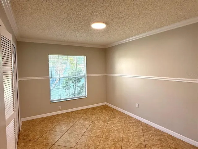 an empty room with a empty space and windows