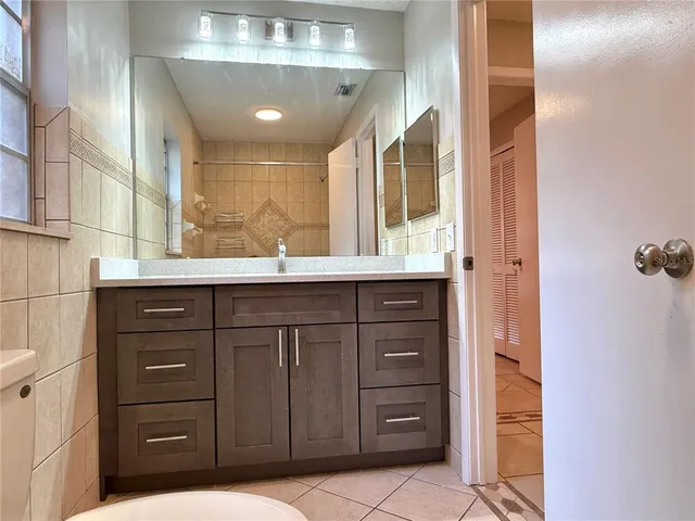 a bathroom with a toilet a sink and a shower
