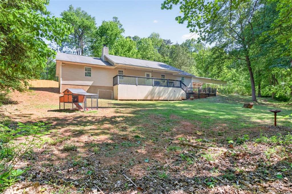 386 Ridgewood Drive Pendergrass, GA 30567 - Photo 32 of 50 a view of a house with backyard and a tree