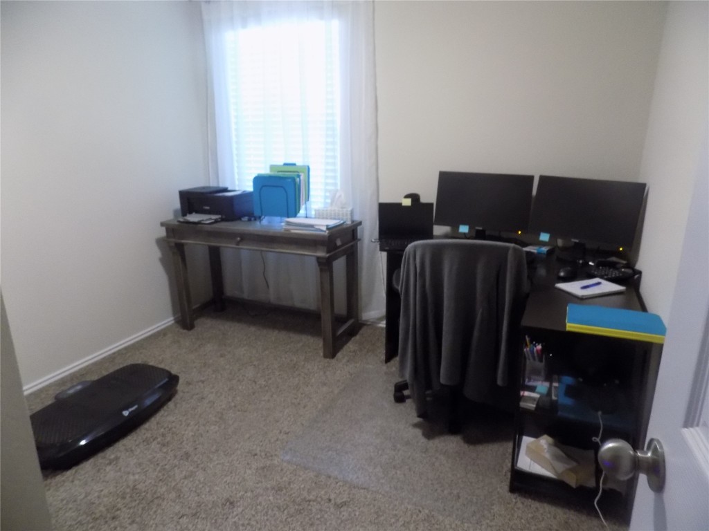 124 Rearden Boulevard Jarrell, TX 76537 - Photo 13 of 16 a room with furniture and a window