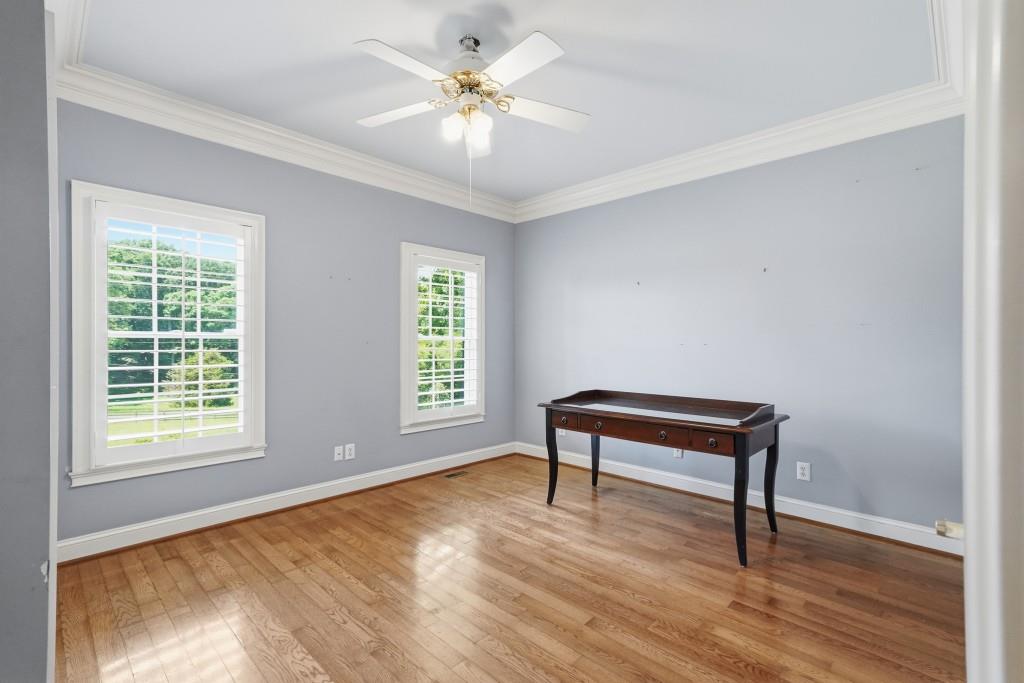 774 Bray Road Southwest Calhoun, GA 30701 - Photo 44 of 106 a view of an empty room with window and wooden floor