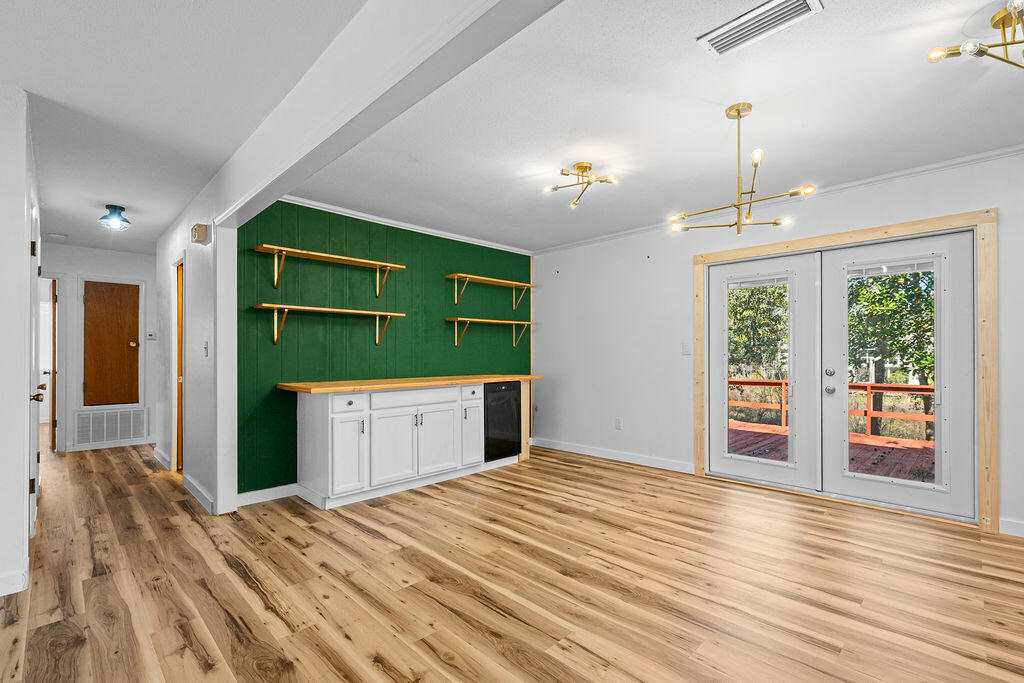 1623 18th Street Niceville, FL 32578 - Photo 16 of 41 a bedroom with a bed and a window