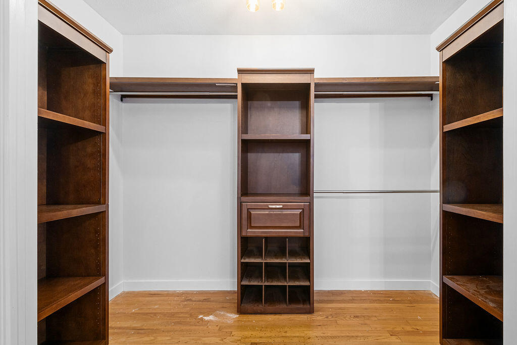 1623 18th Street Niceville, FL 32578 - Photo 20 of 41 a view of an empty room with wooden floor and a cabinet