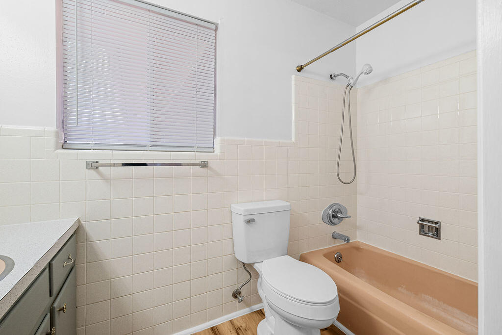 1623 18th Street Niceville, FL 32578 - Photo 22 of 41 a bathroom with a toilet and a bathtub