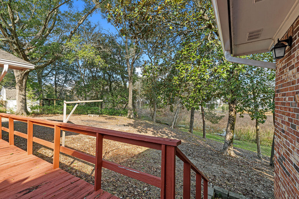 1623 18th Street Niceville, FL 32578 - Photo 32 of 41 a view of a wooden deck and a backyard